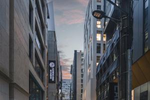 a street in a city with tall buildings at GOYOO INN & cabins in Seoul