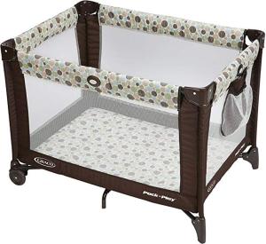 a crib bed with a tennis racket on it at Poppy's Place in Chanute
