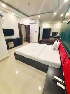 a bedroom with a large bed in a room at Hưng Phú Hotel HCM in Ho Chi Minh City