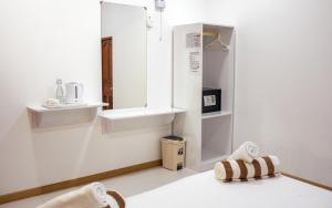 a bathroom with a sink and a mirror at Velana View at Mathiveri in Mathiveri