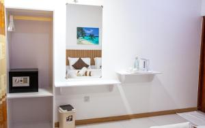 a room with white walls and white shelves at Velana View at Mathiveri in Mathiveri