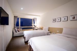Voodi või voodid majutusasutuse Wemeet Hotel Taipei toas