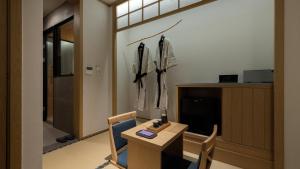 a room with a table and chairs in a room at Anook Ryokan Hotel Eunpyeong Bulgwang in Seoul