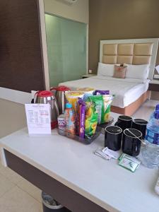 a table in a hotel room with food and drinks at osaka hotel batam in Nagoya