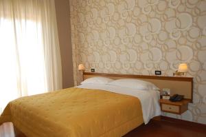 Postel nebo postele na pokoji v ubytování Hotel Ristorante Donato