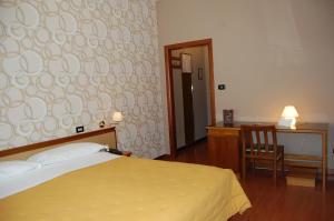 Postel nebo postele na pokoji v ubytování Hotel Ristorante Donato