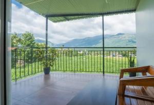 a large balcony with a view of the mountains at Le Sancta homestay in Maraiyūr +17 photos