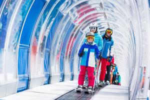 a group of three people on skis in a tunnel at Chillas apart mattle at in Kappl