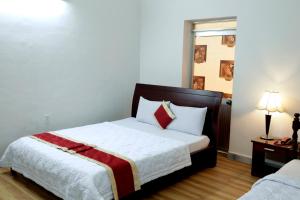 Postel nebo postele na pokoji v ubytování Tan Da Hotel