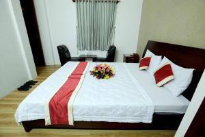 Postel nebo postele na pokoji v ubytování Tan Da Hotel
