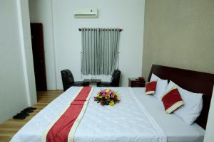 Postel nebo postele na pokoji v ubytování Tan Da Hotel