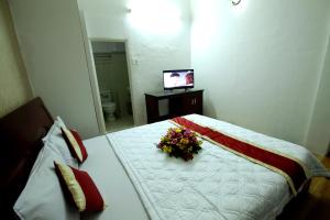 Postel nebo postele na pokoji v ubytování Tan Da Hotel