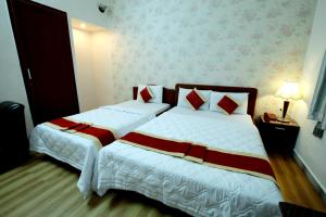 Postel nebo postele na pokoji v ubytování Tan Da Hotel