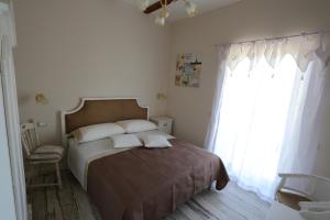 A bed or beds in a room at Ambrosio Relais