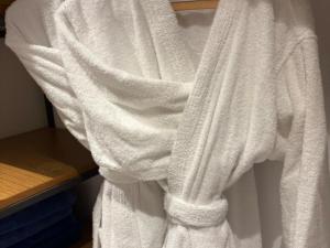 a white towel is hanging on a shelf at דירה בוטיק in Rishon LeẔiyyon +21 photos