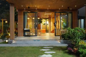an entrance to a house with glass doors at Anvi Haven in Sóc Sơn