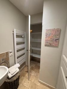 a bathroom with a sink and a toilet and a sink at Escapade entre Mer et Montagnes in Saint-Martin-du-Var +15 photos