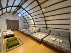 an overhead view of a room with four beds at Nature Escape Farm & Resort in Palayan City