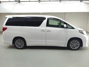 a white van is parked in a garage at Rabbit Car Safari in Dar es Salaam
