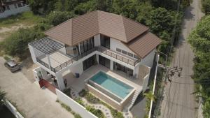 an overhead view of a house with a swimming pool at Rancho Relaxo Pool Villa in Ban Tai
