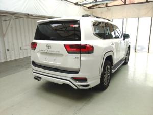 a white suv parked in a garage at Rabbit Car Safari in Dar es Salaam