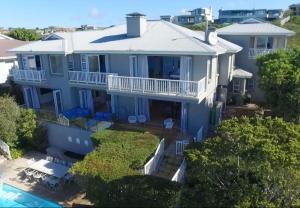an aerial view of a blue house at Plett Azure Guesthouse in Plettenberg Bay