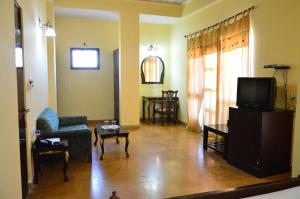 TV a/nebo společenská místnost v ubytování Hotel Amer View + 27 fotografií