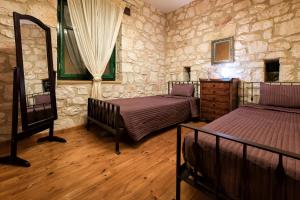 Postel nebo postele na pokoji v ubytování Anassa Villa