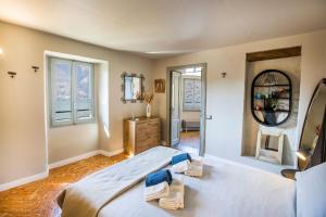 a bedroom with a large bed and a mirror at Il Giardino di Nesso in Nesso