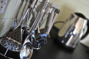 a group of kitchen utensils hanging on a rack at Hartaval & Baca Ruadh in Staffin