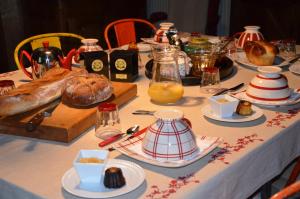 a table with bread and other food on it at La Fournio in Chaussenac +21 photos