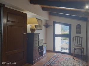 a room with a dresser and a lamp and a door at Villa Amalia - mansarda B&B in Cinisi +24 photos