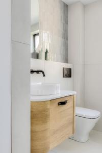 a bathroom with a sink and a toilet at Medusa Bondi in Sydney +130 photos