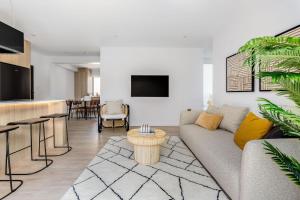 a living room with a couch and a table at Medusa Bondi in Sydney