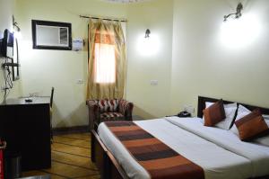 Postel nebo postele na pokoji v ubytování Hotel Amer View