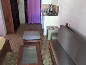 a living room with a couch and a table at Sam in Mahajanga