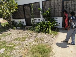 two women standing outside of a house at Sam in Mahajanga