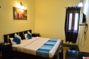 Postel nebo postele na pokoji v ubytování Hotel Amer View
