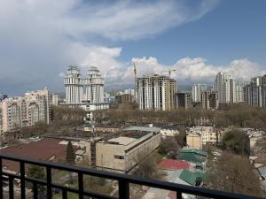 a view of a large city with tall buildings at Hotel 777 in Dushanbe