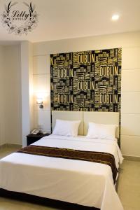 Postel nebo postele na pokoji v ubytování Lilly Hotel