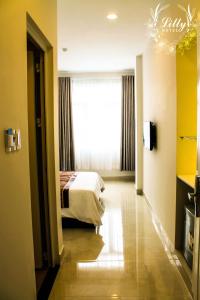 Postel nebo postele na pokoji v ubytování Lilly Hotel
