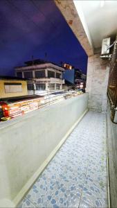 a view of a rooftop of a building at night at 57 hua hin in Hua Hin +1 photo