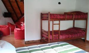 a room with two bunk beds in a room at La Protegida in El Chalten