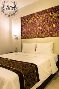 Postel nebo postele na pokoji v ubytování Lilly Hotel