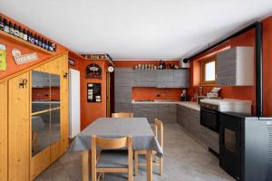 a kitchen with a table and chairs in it at Bella Vita Stays Relax in Sondrio