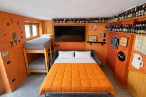 a small room with a bed and a bunk bed at Bella Vita Stays Relax in Sondrio