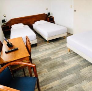 เตียงในห้องที่ Hôtel De Champagne +75 ภาพ