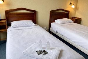 เตียงในห้องที่ Hôtel De Champagne