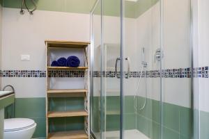 a bathroom with a shower and a toilet at Villa Penelope in Terracina +48 photos