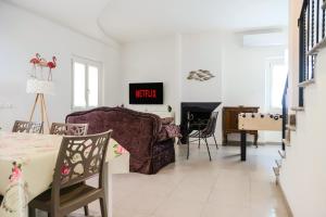 a living room with a couch and a table at Villa Penelope in Terracina